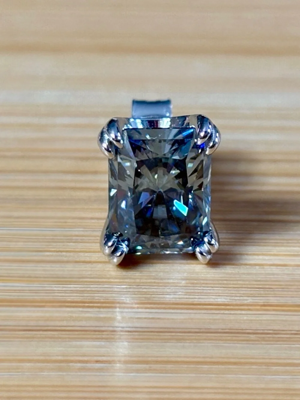 6ctw gray radiant Moissanite studs in sterling mountings with double claws!